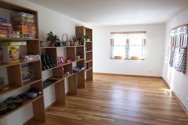 8101 Greenwood Road Hebron, IL 60034 - Photo 18 of 39 a view of a room with shelves on the wall and window