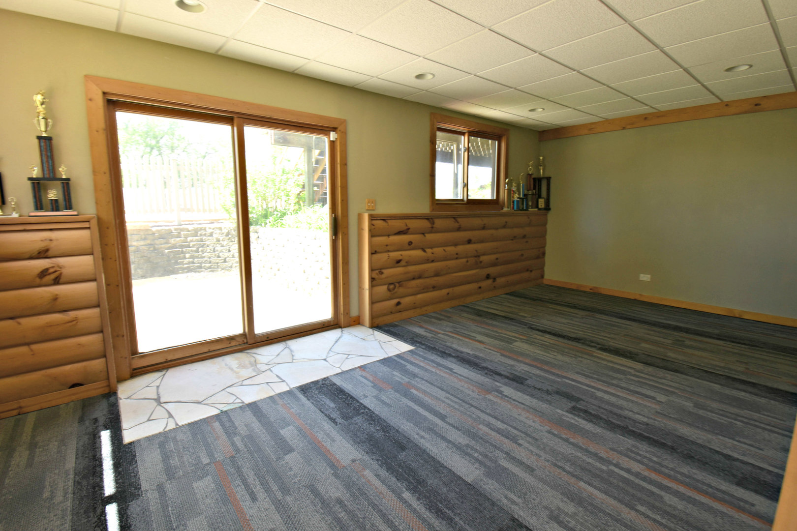 8101 Greenwood Road Hebron, IL 60034 - Photo 20 of 39 a view of an empty room with a window and wooden floor