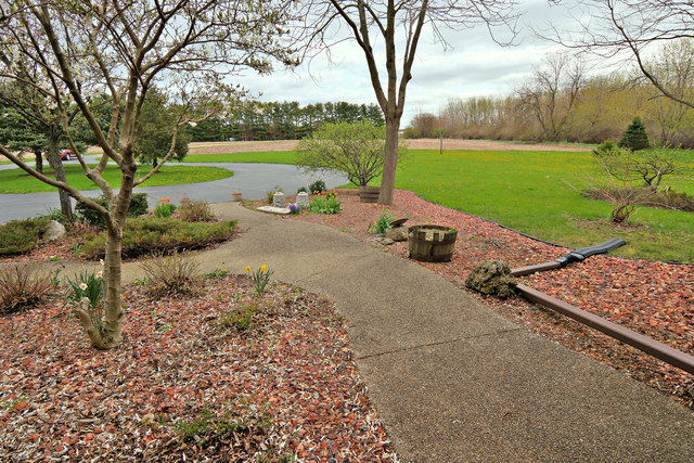 8101 Greenwood Road Hebron, IL 60034 - Photo 26 of 39 a view of a garden with an outdoor space