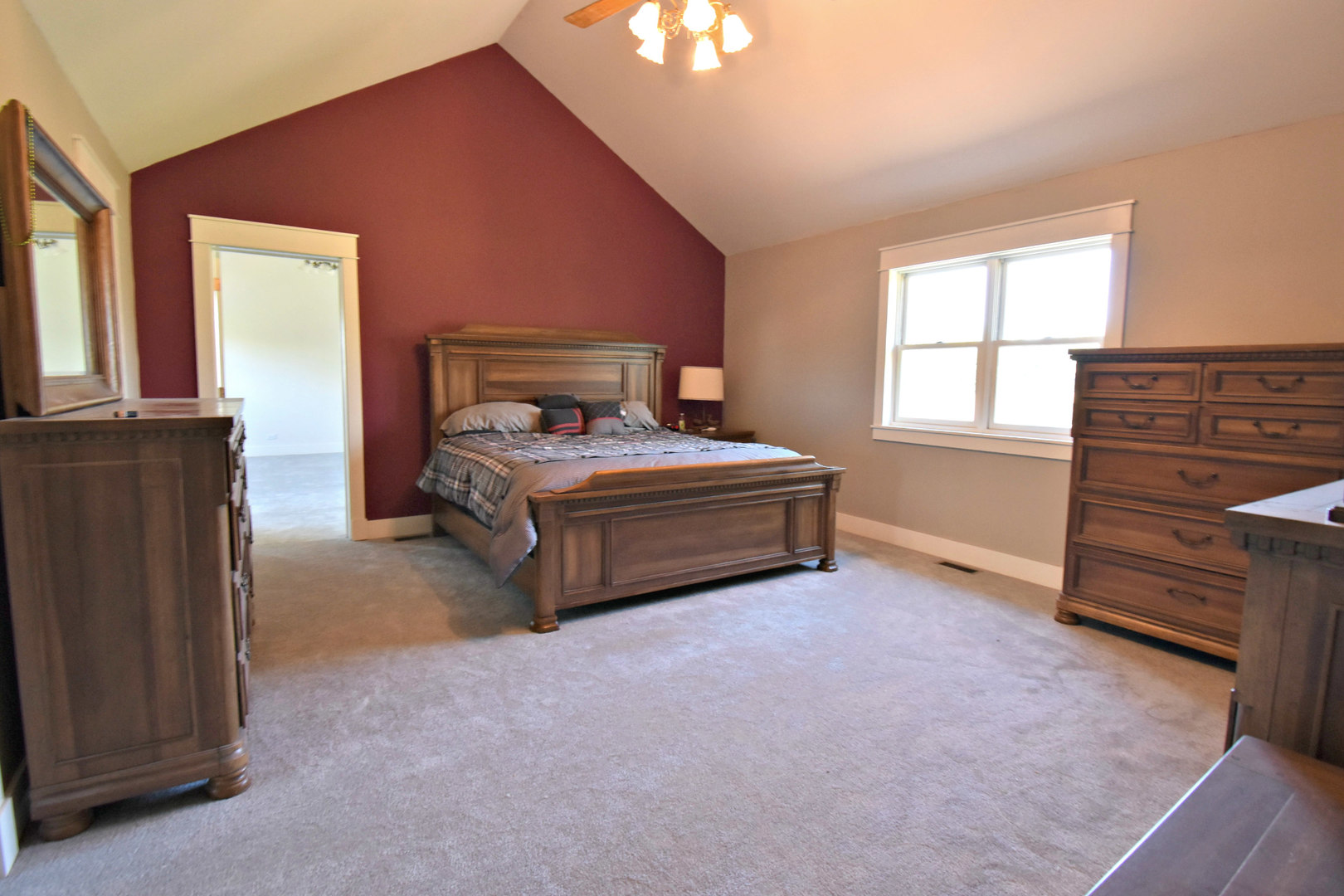 8101 Greenwood Road Hebron, IL 60034 - Photo 28 of 39 a spacious bedroom with a bed and a window