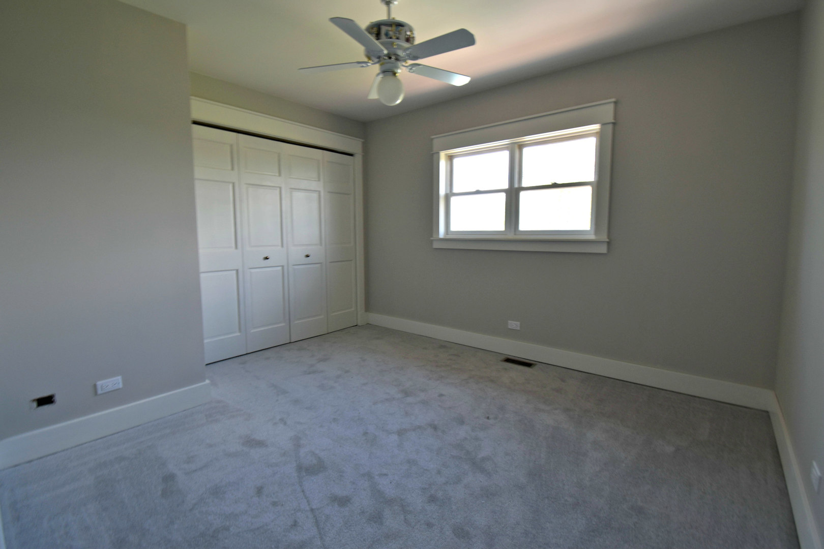 8101 Greenwood Road Hebron, IL 60034 - Photo 31 of 39 an empty room with a window and a fan