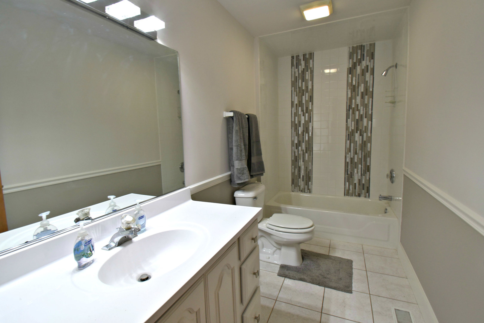 8101 Greenwood Road Hebron, IL 60034 - Photo 33 of 39 a bathroom with a sink a toilet and shower