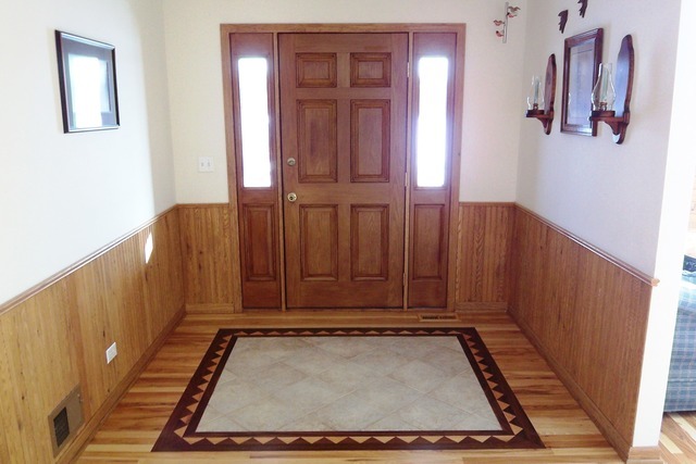 8101 Greenwood Road Hebron, IL 60034 - Photo 6 of 39 a view of an entryway with wooden floor and door