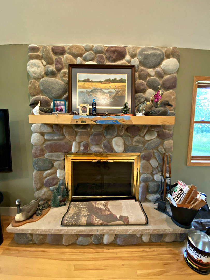 8101 Greenwood Road Hebron, IL 60034 - Photo 9 of 39 a living room with furniture and a fireplace