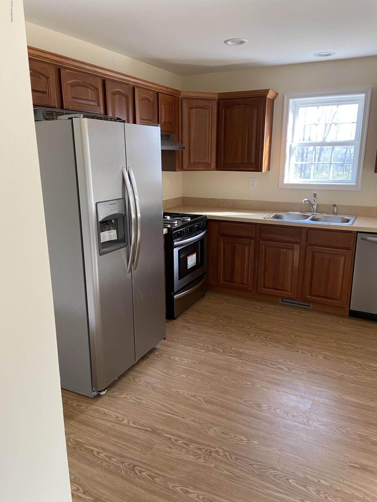 330 Chestnut Road Blakeslee, PA 18610 - Photo 7 of 29 a kitchen with stainless steel appliances granite countertop a refrigerator and a sink