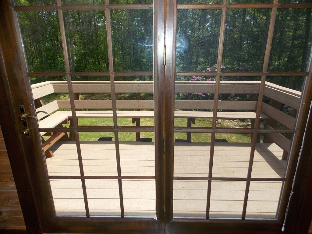 7 Betty Spring Road Freetown, MA 02717 - Photo 17 of 30 a view of a glass door with a balcony from a window