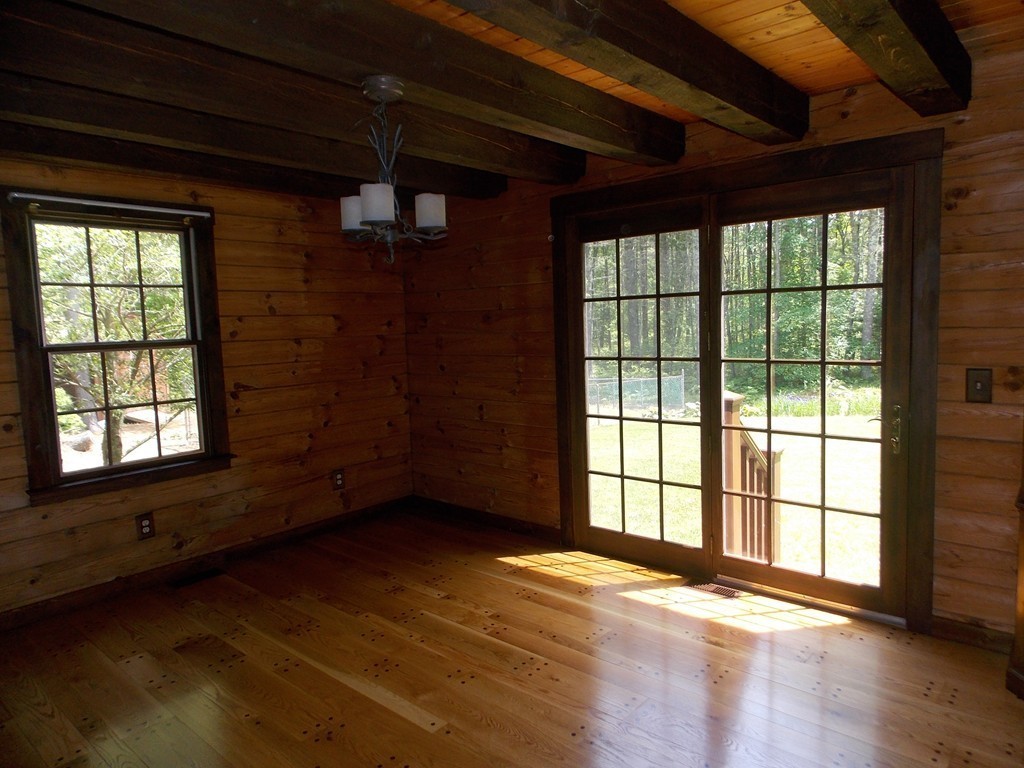 7 Betty Spring Road Freetown, MA 02717 - Photo 4 of 30 a view of an empty room with wooden floor and a window