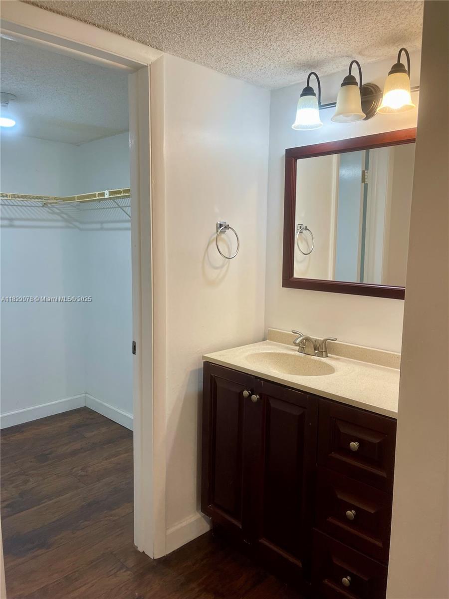 430 Commodore Drive, Unit 301 Plantation, FL 33325 - Photo 17 of 26 a bathroom with a sink and a mirror