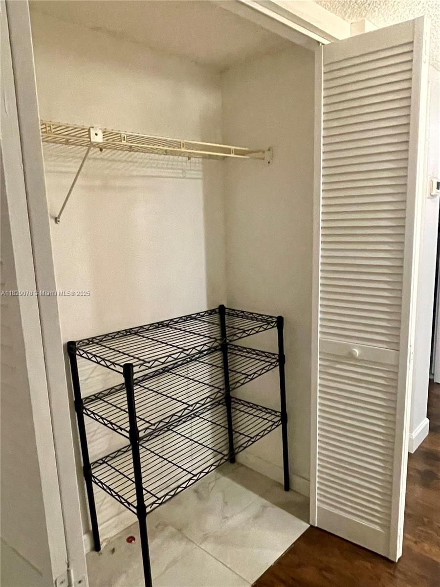 430 Commodore Drive, Unit 301 Plantation, FL 33325 - Photo 23 of 26 a view of a room with racks on the wall