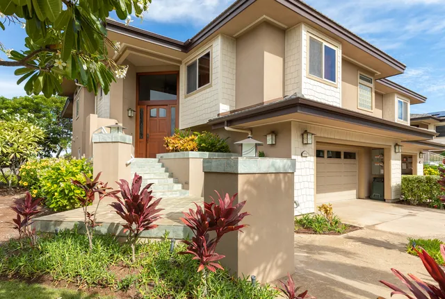 front view of a house with a yard
