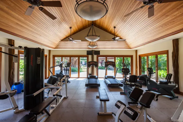 a view of a livingroom with furniture hardwood floor and a chandelier