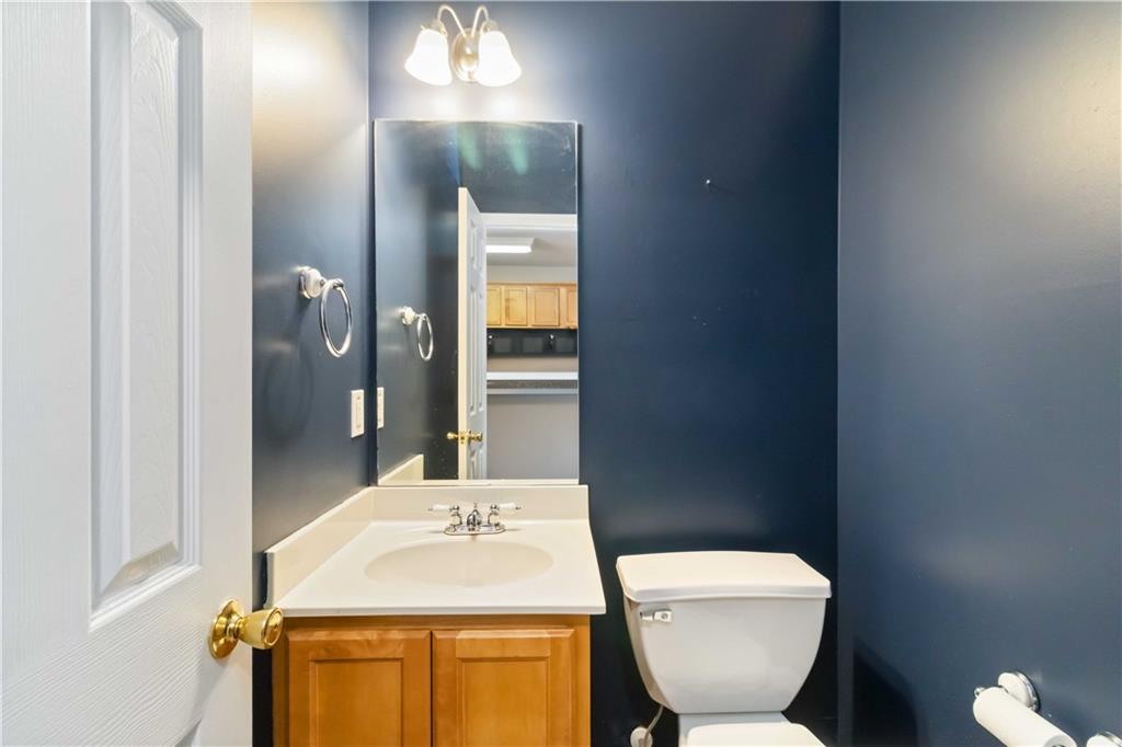 3864 Guilderoy Lane, Unit 3 Austell, GA 30106 - Photo 11 of 27 a bathroom with a toilet sink and mirror