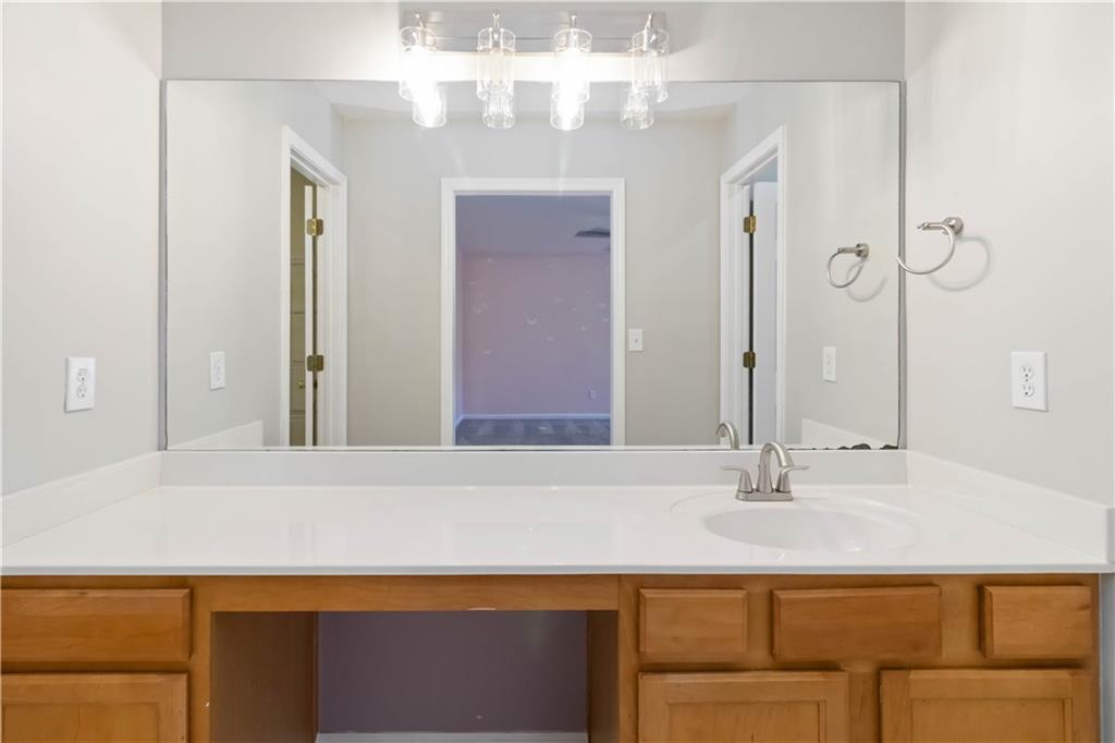 3864 Guilderoy Lane, Unit 3 Austell, GA 30106 - Photo 15 of 27 a bathroom with a sink and a mirror