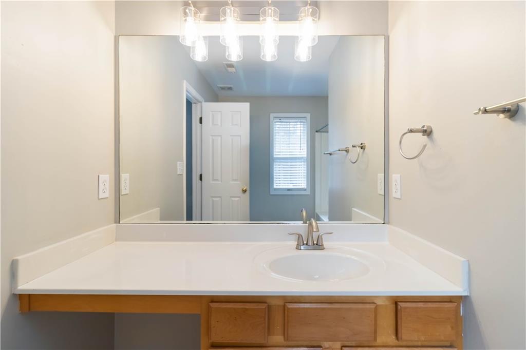 3864 Guilderoy Lane, Unit 3 Austell, GA 30106 - Photo 20 of 27 a bathroom with a sink and a mirror