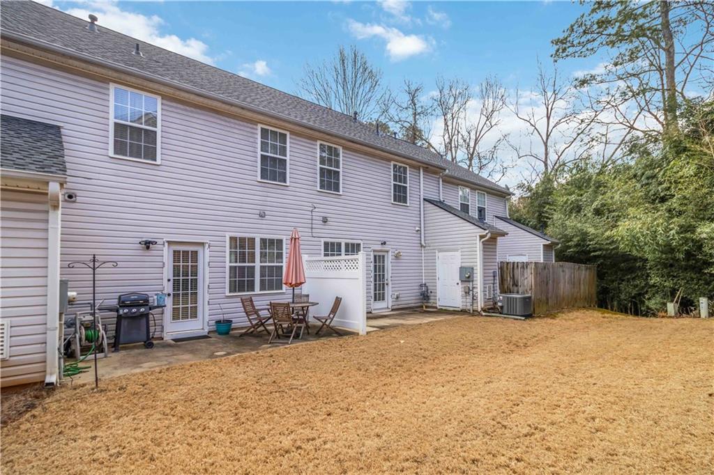 3864 Guilderoy Lane, Unit 3 Austell, GA 30106 - Photo 23 of 27 a view of a house with a yard covered in snow