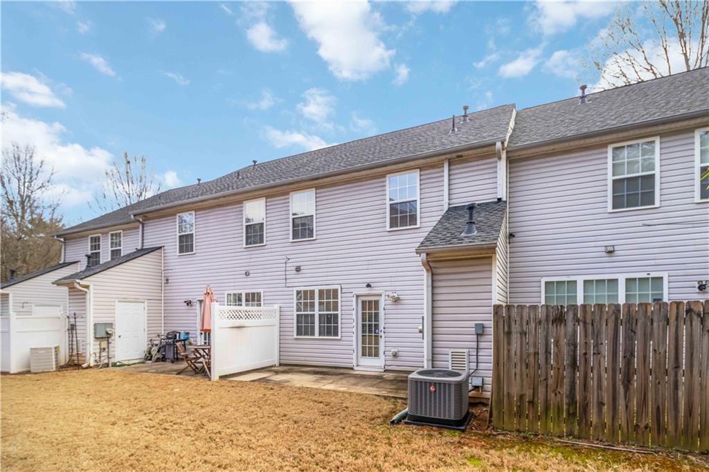 3864 Guilderoy Lane, Unit 3 Austell, GA 30106 - Photo 25 of 27 a view of a house with a patio