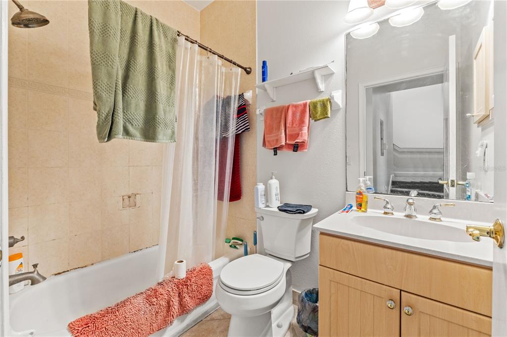 2204 1st Street, Unit F Indian Rocks Beach, FL 33785 - Photo 20 of 37 a bathroom with a sink toilet and shower