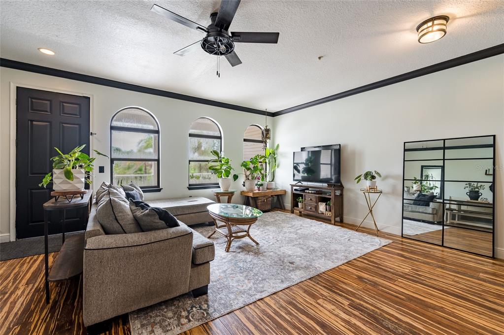 2204 1st Street, Unit F Indian Rocks Beach, FL 33785 - Photo 25 of 37 a living room with furniture and a wooden floor