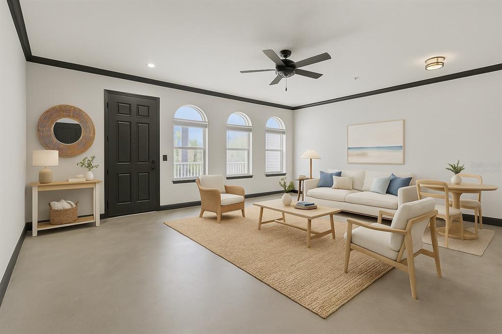 2204 1st Street, Unit F Indian Rocks Beach, FL 33785 - Photo 26 of 37 a living room with furniture and a large window