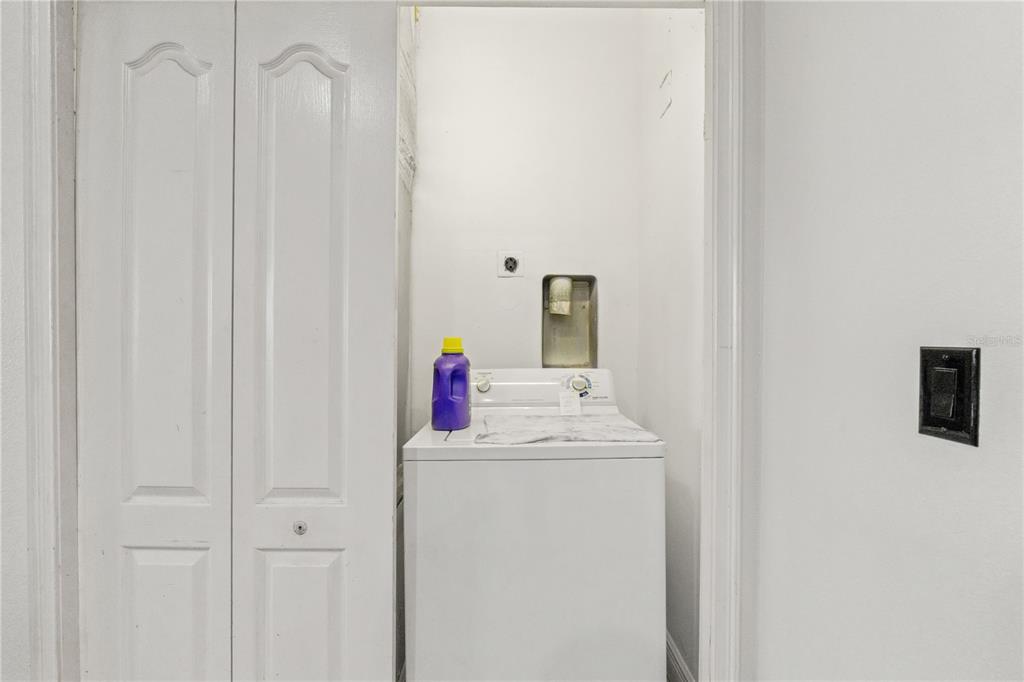 2204 1st Street, Unit F Indian Rocks Beach, FL 33785 - Photo 28 of 37 a utility room with dryer and washer