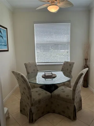 a view of a dining room with furniture and window