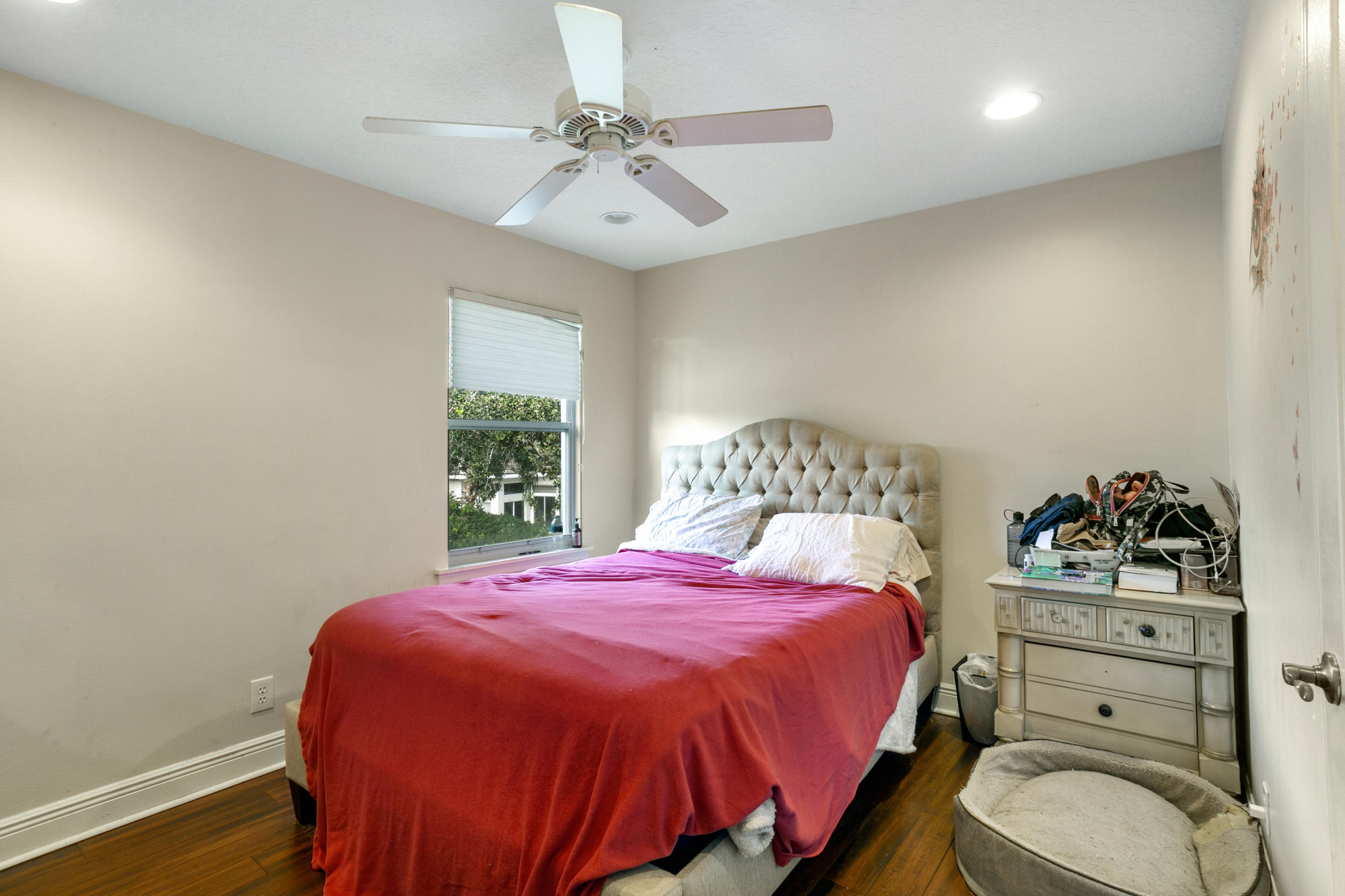 204 Seagull Point Jupiter, FL 33458 - Photo 13 of 18 a bedroom with a bed and a dresser