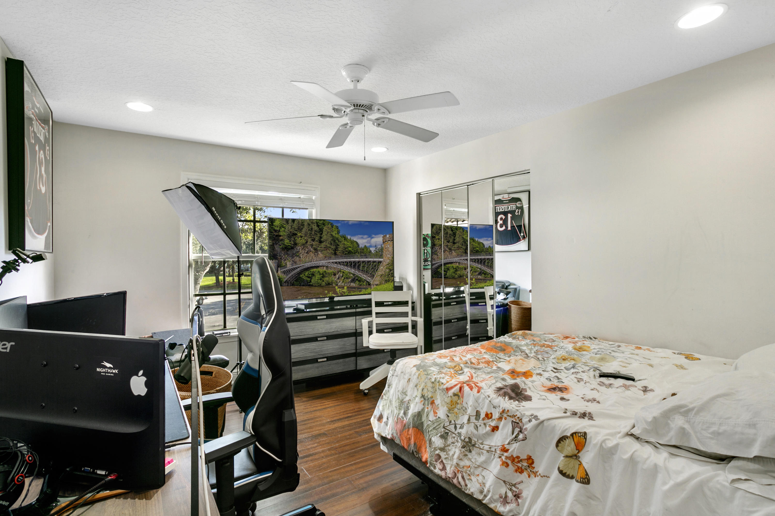 204 Seagull Point Jupiter, FL 33458 - Photo 14 of 18 a bedroom with a bed and a flat tv screen on dresser