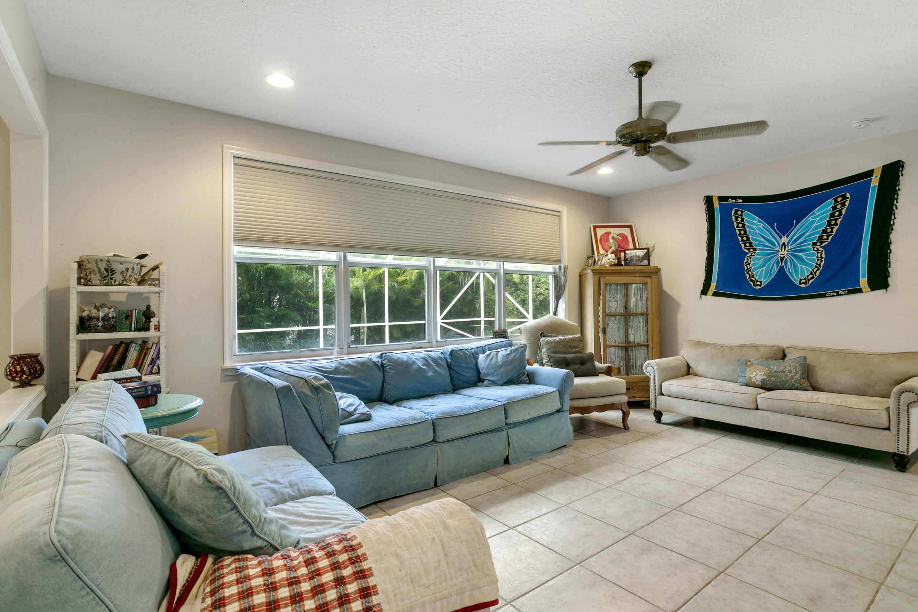 204 Seagull Point Jupiter, FL 33458 - Photo 4 of 18 a living room with furniture and a large window