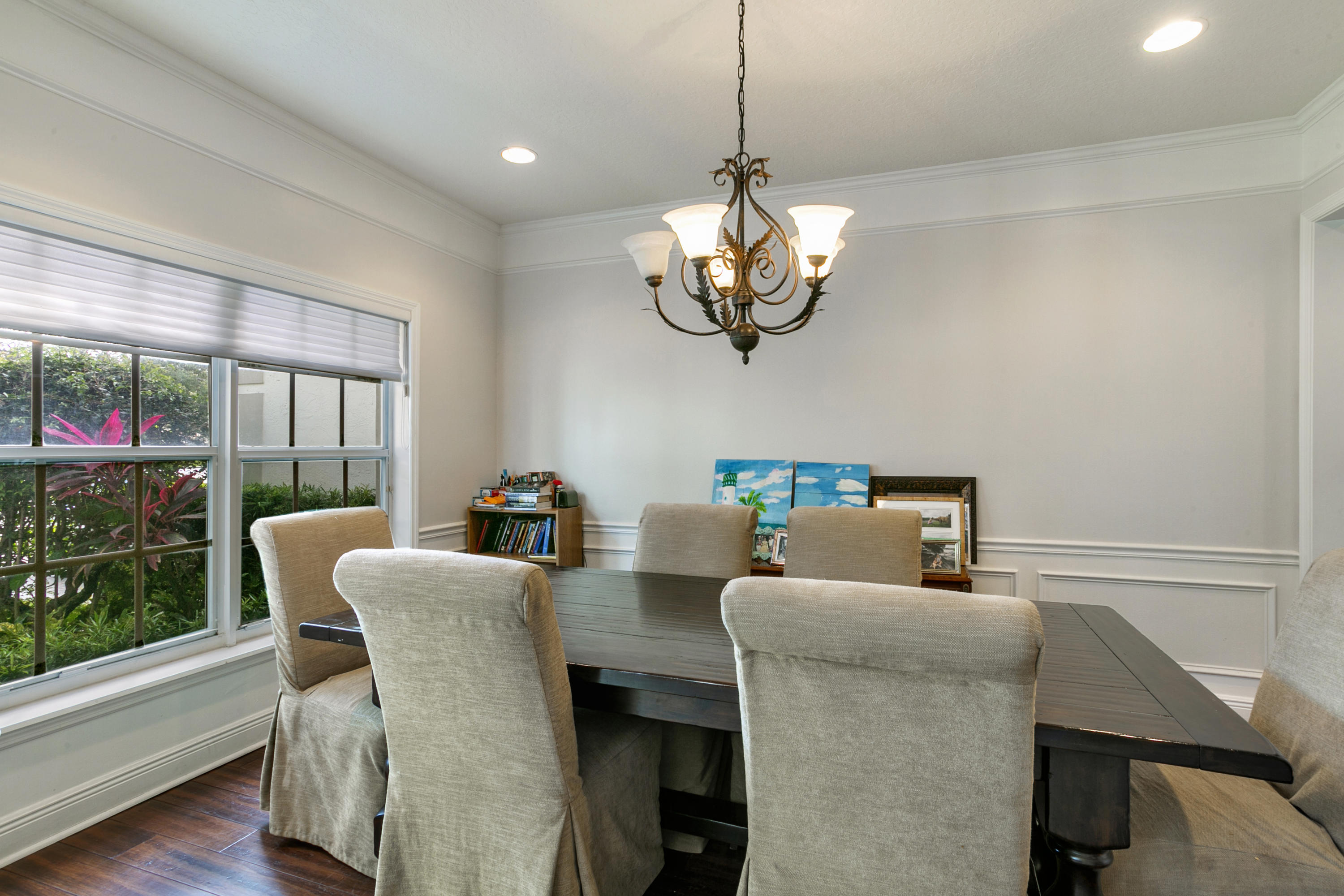 204 Seagull Point Jupiter, FL 33458 - Photo 6 of 18 a view of a dining room with furniture wooden floor and chandelier