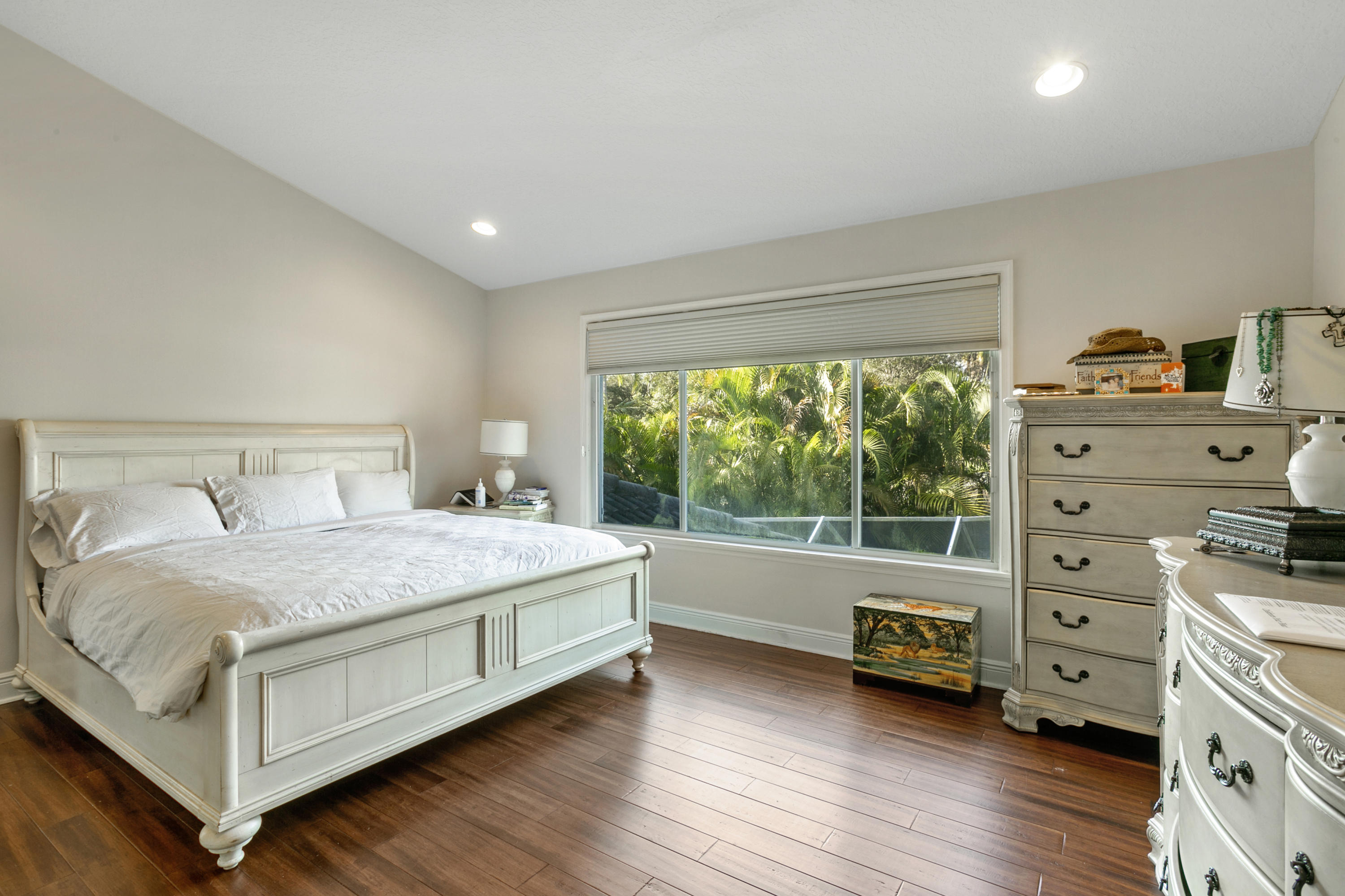 204 Seagull Point Jupiter, FL 33458 - Photo 8 of 18 a bedroom with a bed and a window