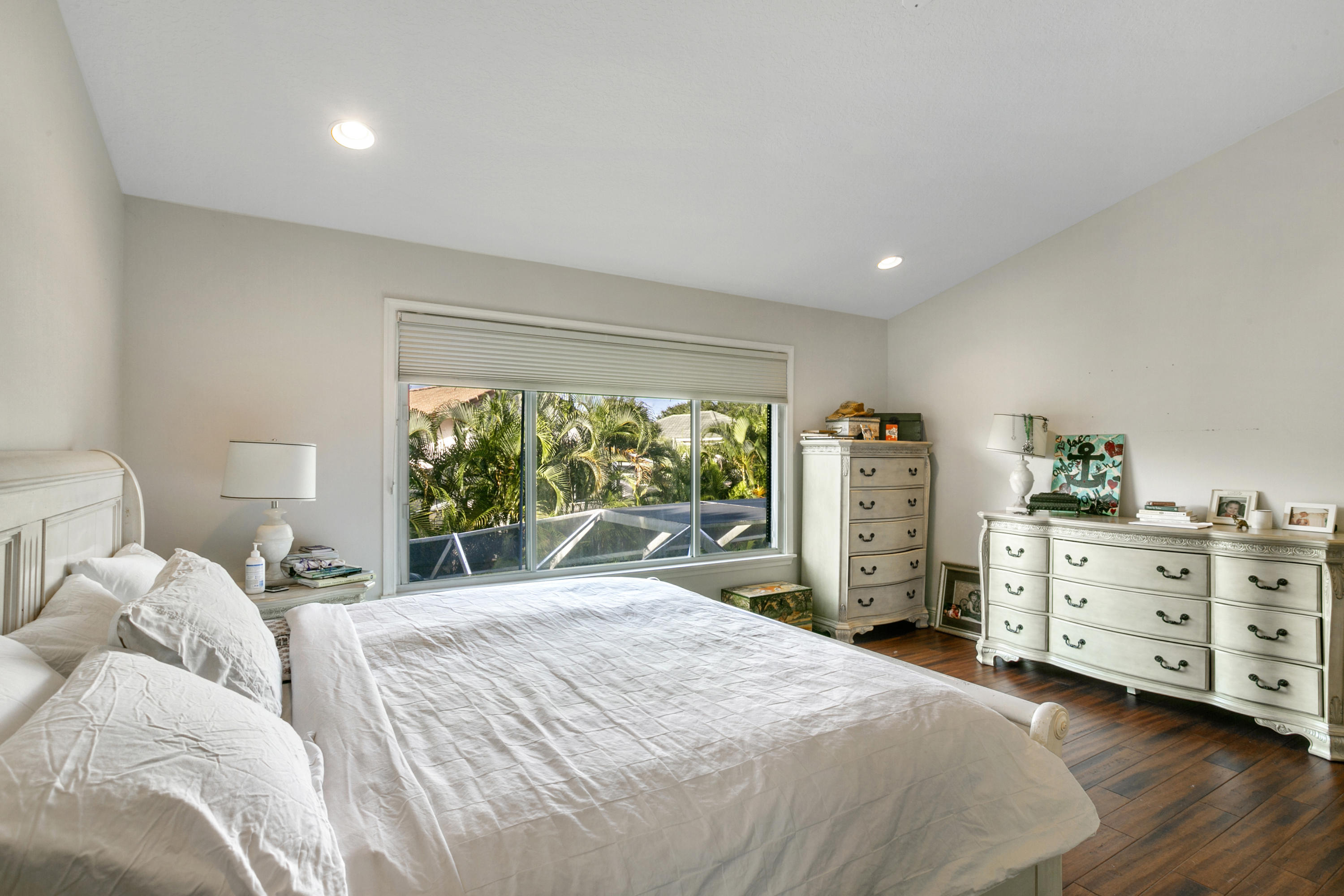 204 Seagull Point Jupiter, FL 33458 - Photo 9 of 18 a bedroom with a large bed and large windows