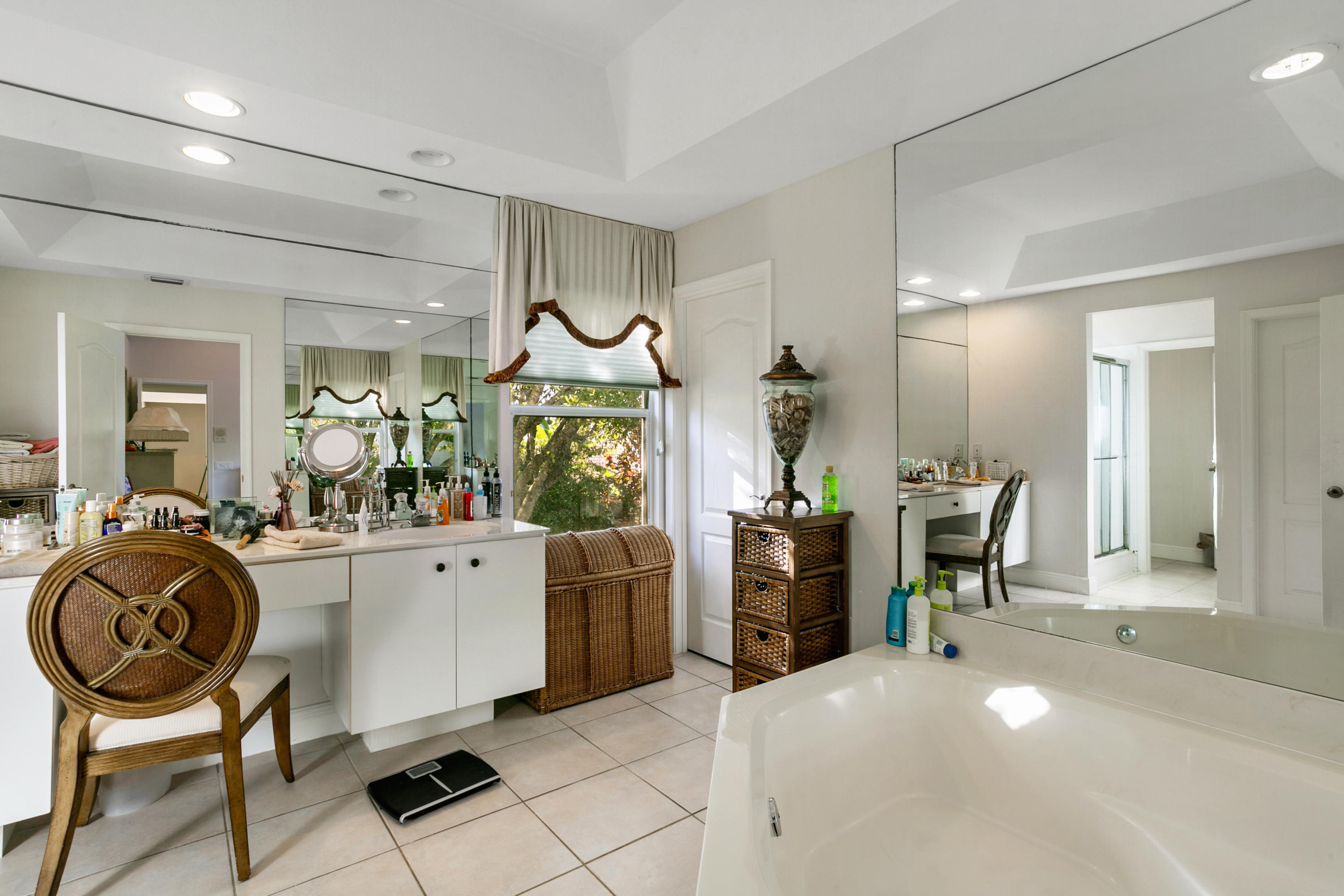 204 Seagull Point Jupiter, FL 33458 - Photo 10 of 18 a large white kitchen with a table and chairs