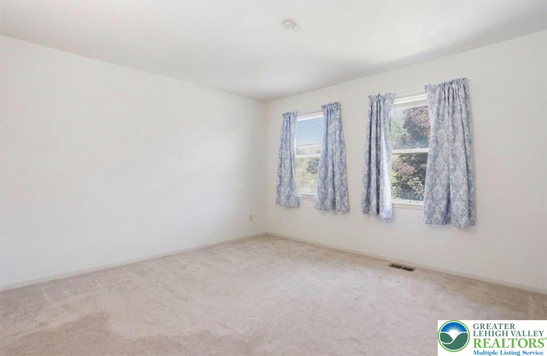 808 Hunter Road Easton, PA 18040 - Photo 24 of 41 An airy bedroom with soft carpeting and ample natural light from three windows. Virtually decluttered