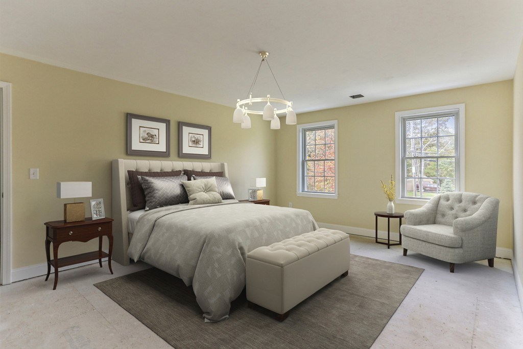 76 Box Turtle Drive Rochester, MA 02770 - Photo 5 of 12 a spacious bedroom with a bed and a couch