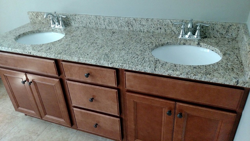 76 Box Turtle Drive Rochester, MA 02770 - Photo 10 of 12 a bathroom with a granite countertop sink and a mirror