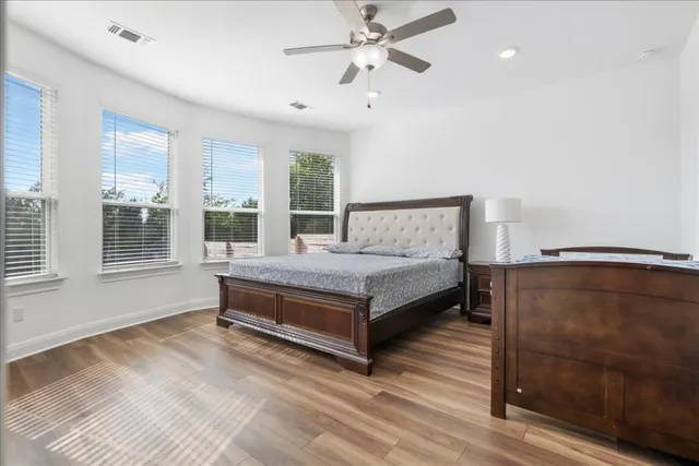 a bedroom with a bed and window
