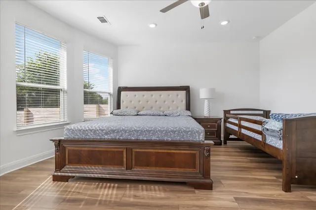 a bedroom with a bed and a window