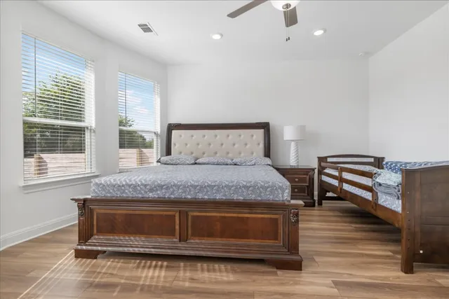 a bedroom with a bed and a window