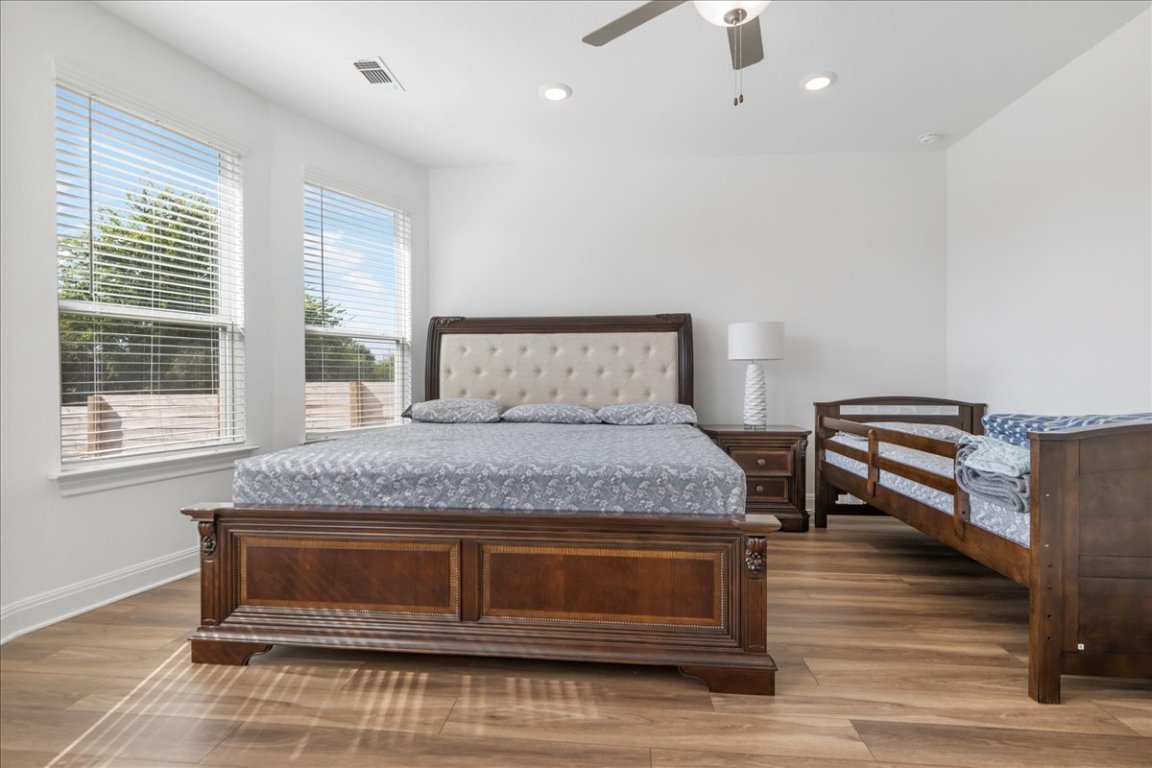 240 Inlet Lane Leander, TX 78641 - Photo 16 of 33 a bedroom with a bed and a window