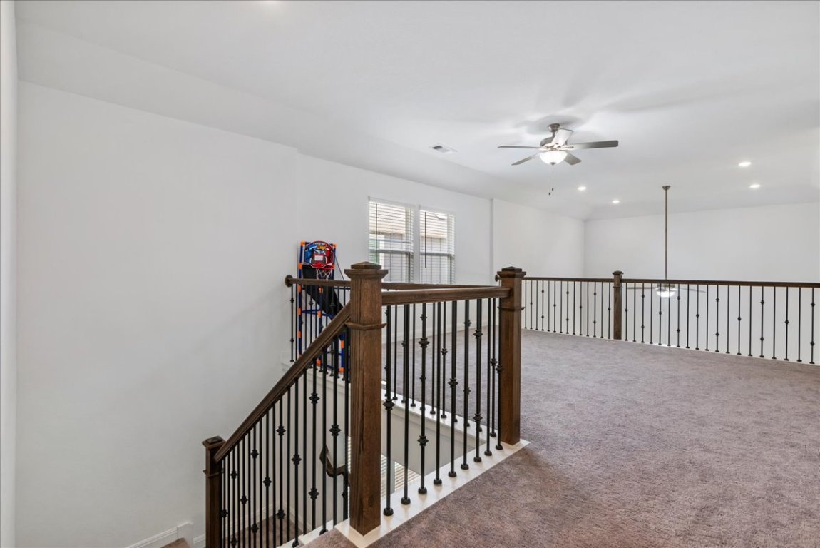 240 Inlet Lane Leander, TX 78641 - Photo 28 of 33 a view of a hallway with a chandelier fan