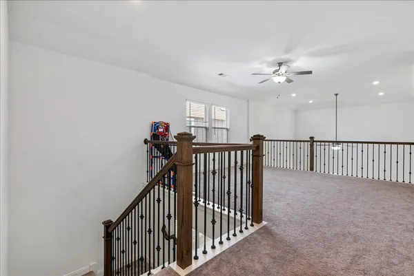 a view of a hallway with a chandelier