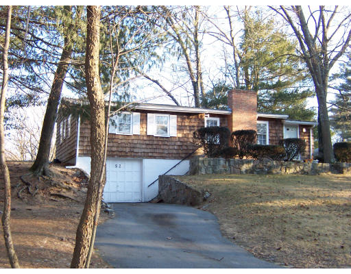 52-50 Summit Road Holbrook, MA 02343 - Photo 2 of 6 a front view of a house with garden