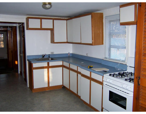 52-50 Summit Road Holbrook, MA 02343 - Photo 3 of 6 a kitchen with stainless steel appliances a stove sink and cabinets