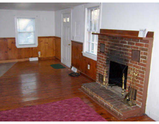 52-50 Summit Road Holbrook, MA 02343 - Photo 5 of 6 a view of a livingroom with furniture and a fireplace