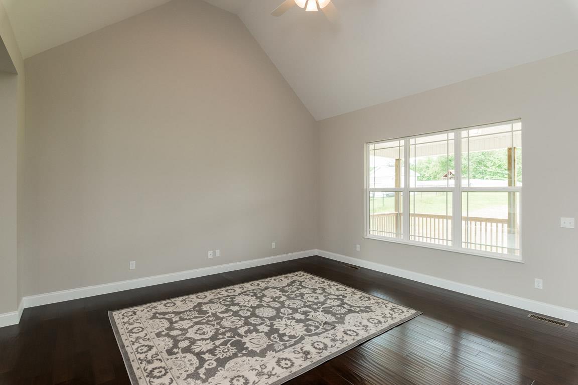 708 Ruby Way White Bluff, TN 37187 - Photo 11 of 30 wooden floor in an empty room with a window