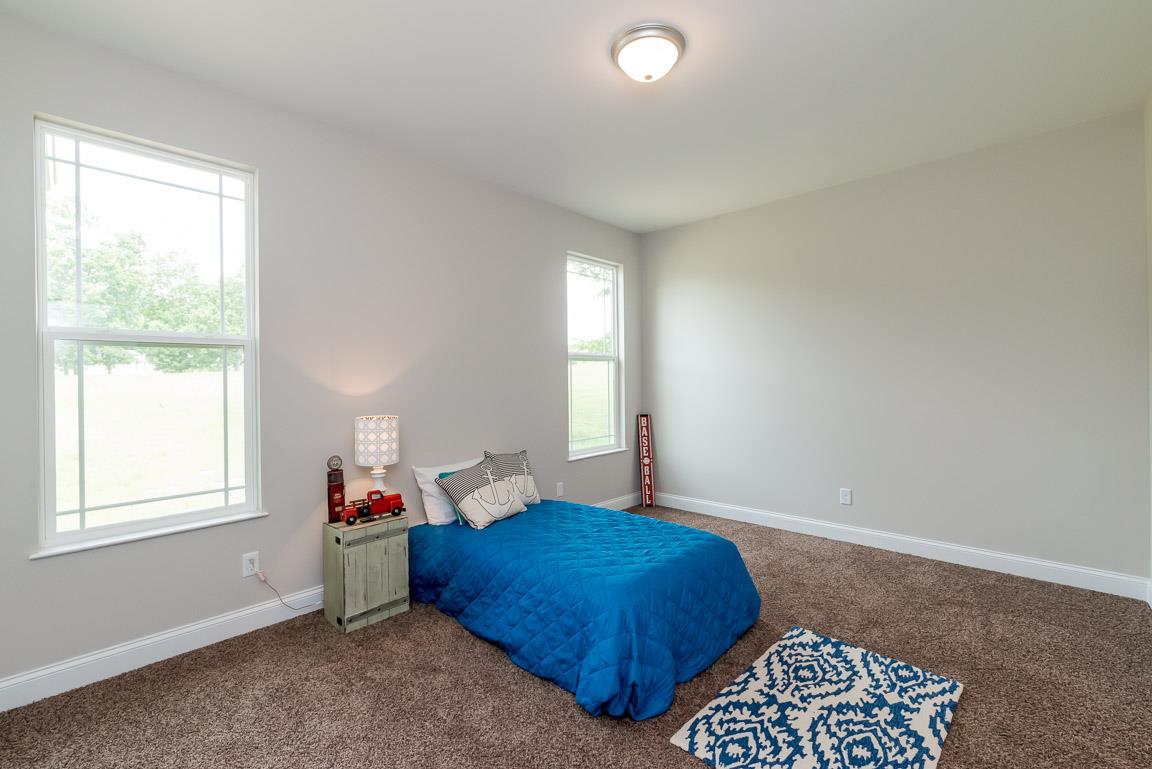 708 Ruby Way White Bluff, TN 37187 - Photo 12 of 30 a bedroom with a bed and window