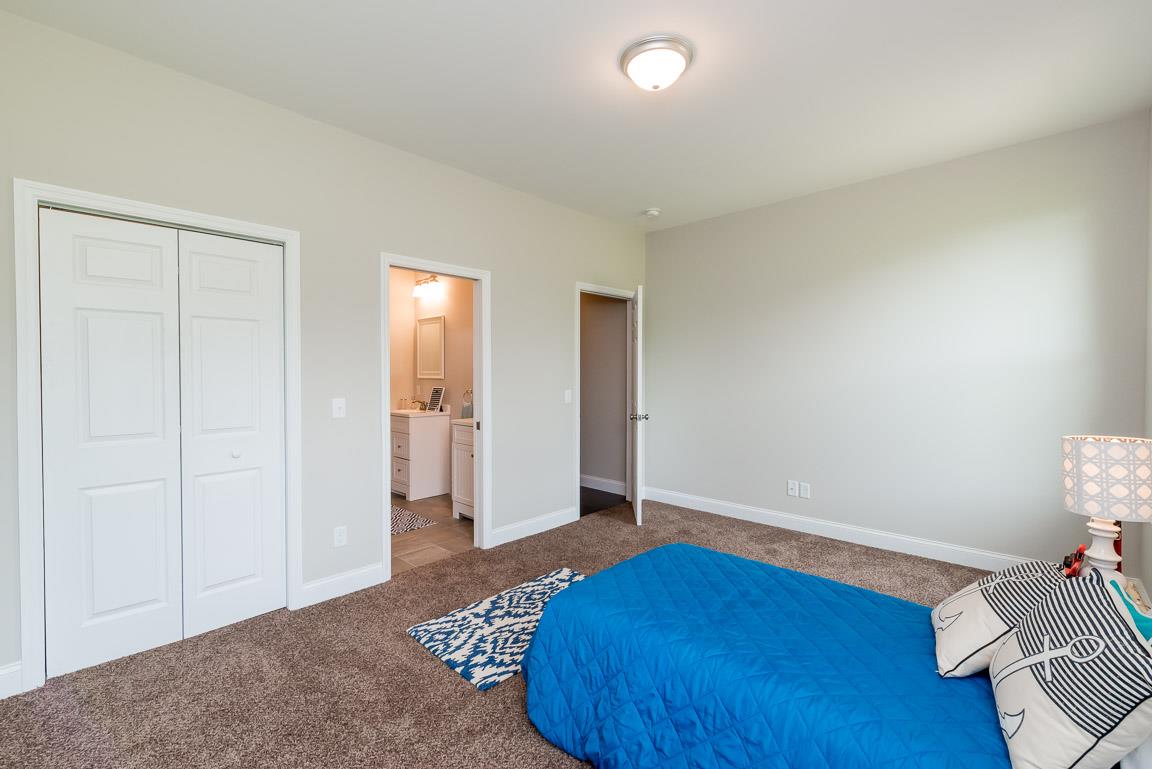 708 Ruby Way White Bluff, TN 37187 - Photo 13 of 30 a bedroom with a bed and closet