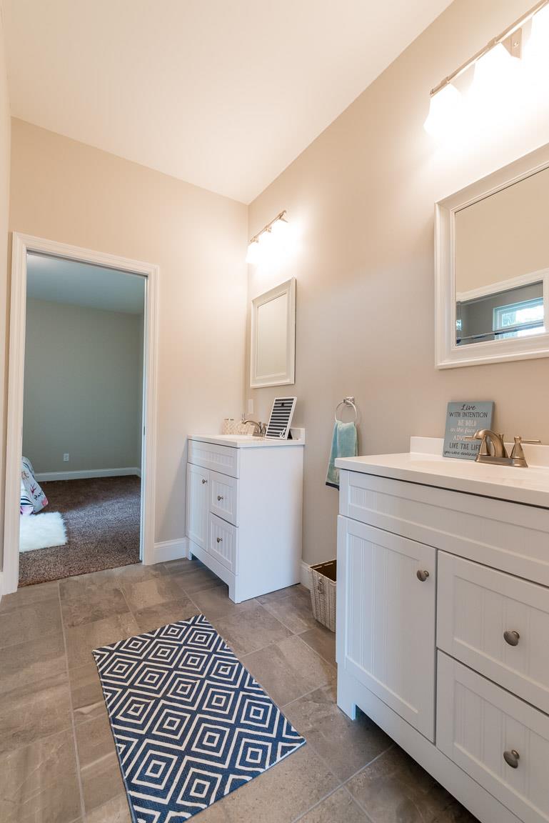 708 Ruby Way White Bluff, TN 37187 - Photo 14 of 30 a bathroom with a sink a mirror and a toilet