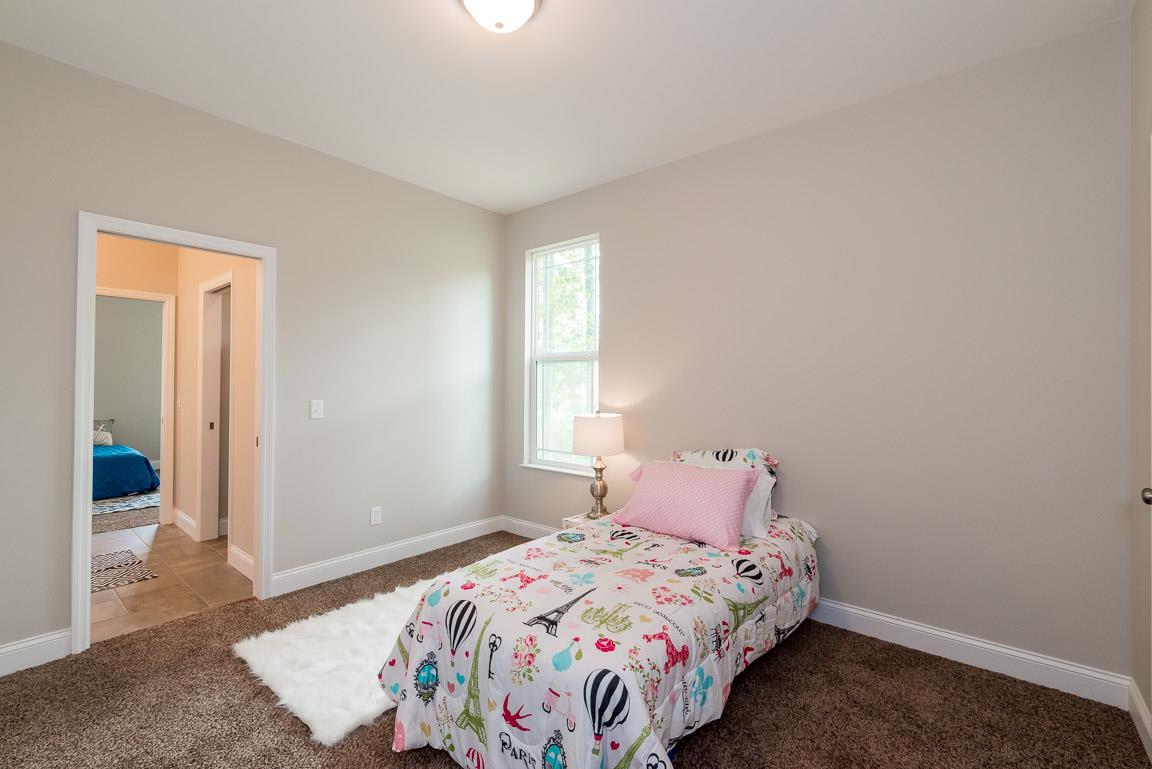 708 Ruby Way White Bluff, TN 37187 - Photo 15 of 30 a bedroom with a bed and a window