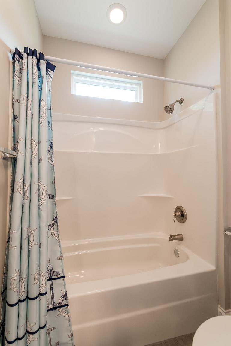 708 Ruby Way White Bluff, TN 37187 - Photo 17 of 30 a bathroom with a shower and a tub